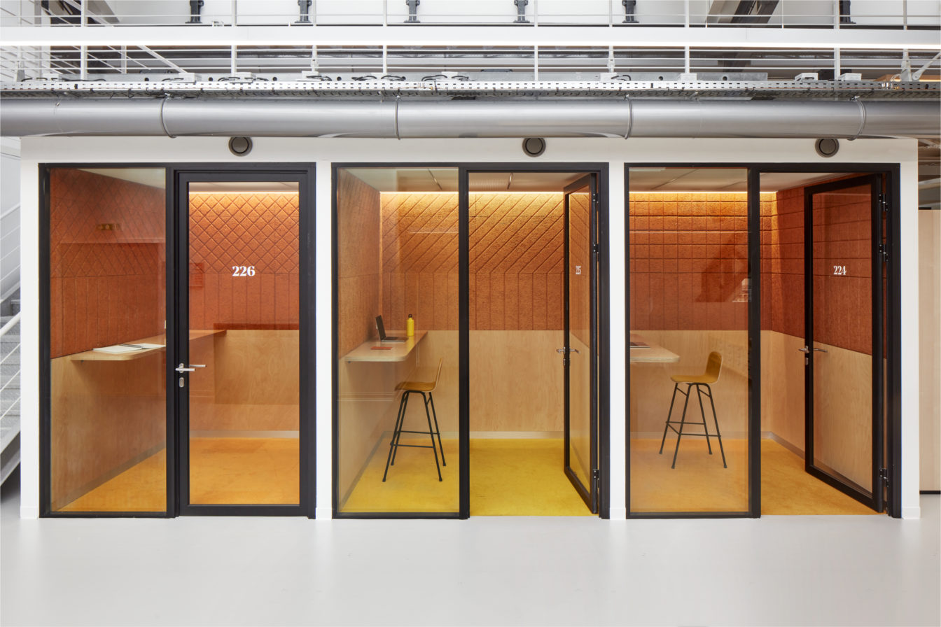Meeting room. Designed with wood wool panels in a orange colour